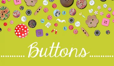 coconut buttons, plastic buttons, spotty buttons, pink buttons, purple buttons, scattered on a green background at The Eternal Maker