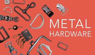 metal hardware bag feet d rings buckles swivel clips keyring fobs purse frames scattered on a red background