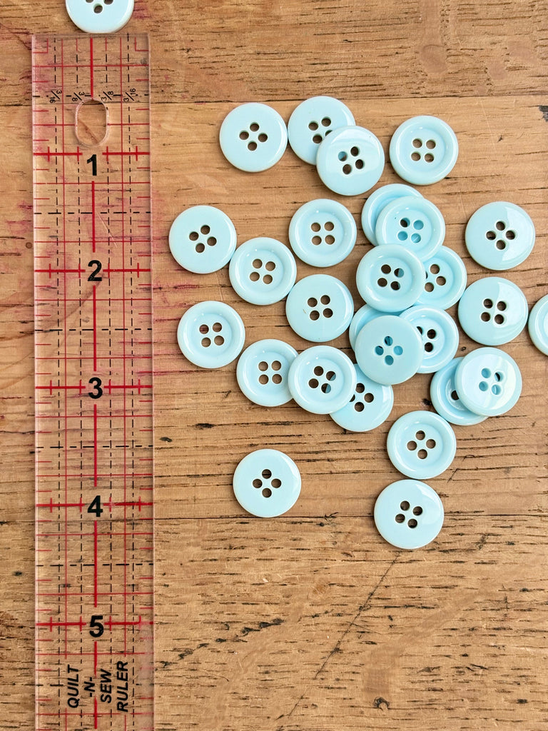 pale blue 4 hole ring edge buttons