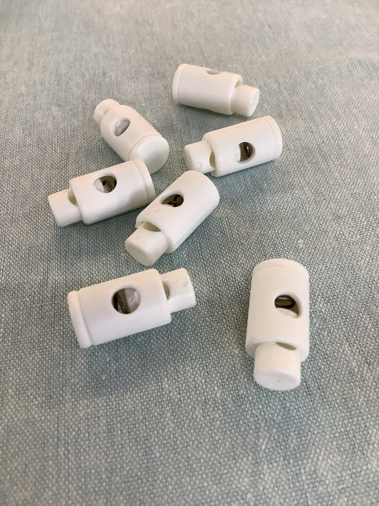 Plastic Cord End Adjusters - White - 26mm with 5mm Internal Hole - The Eternal Maker - UK Fabric Shop