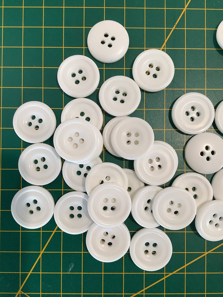 The Button Company Buttons White 4 hole ring edged button with centre dip - 21mm